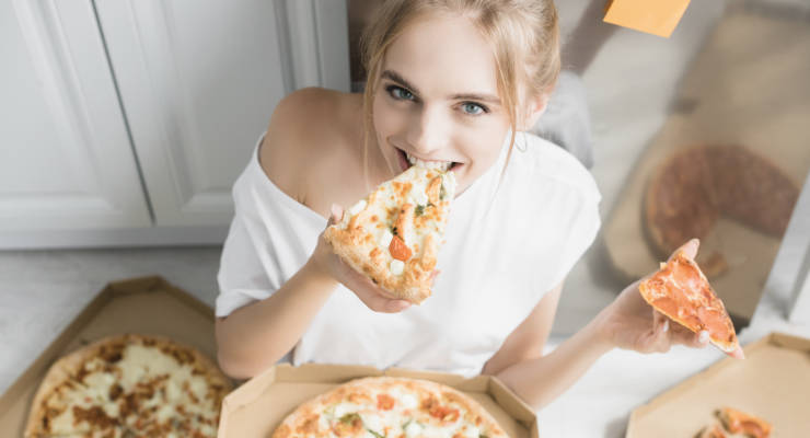 Girl Eating Pizza - CrossCopywriting.com